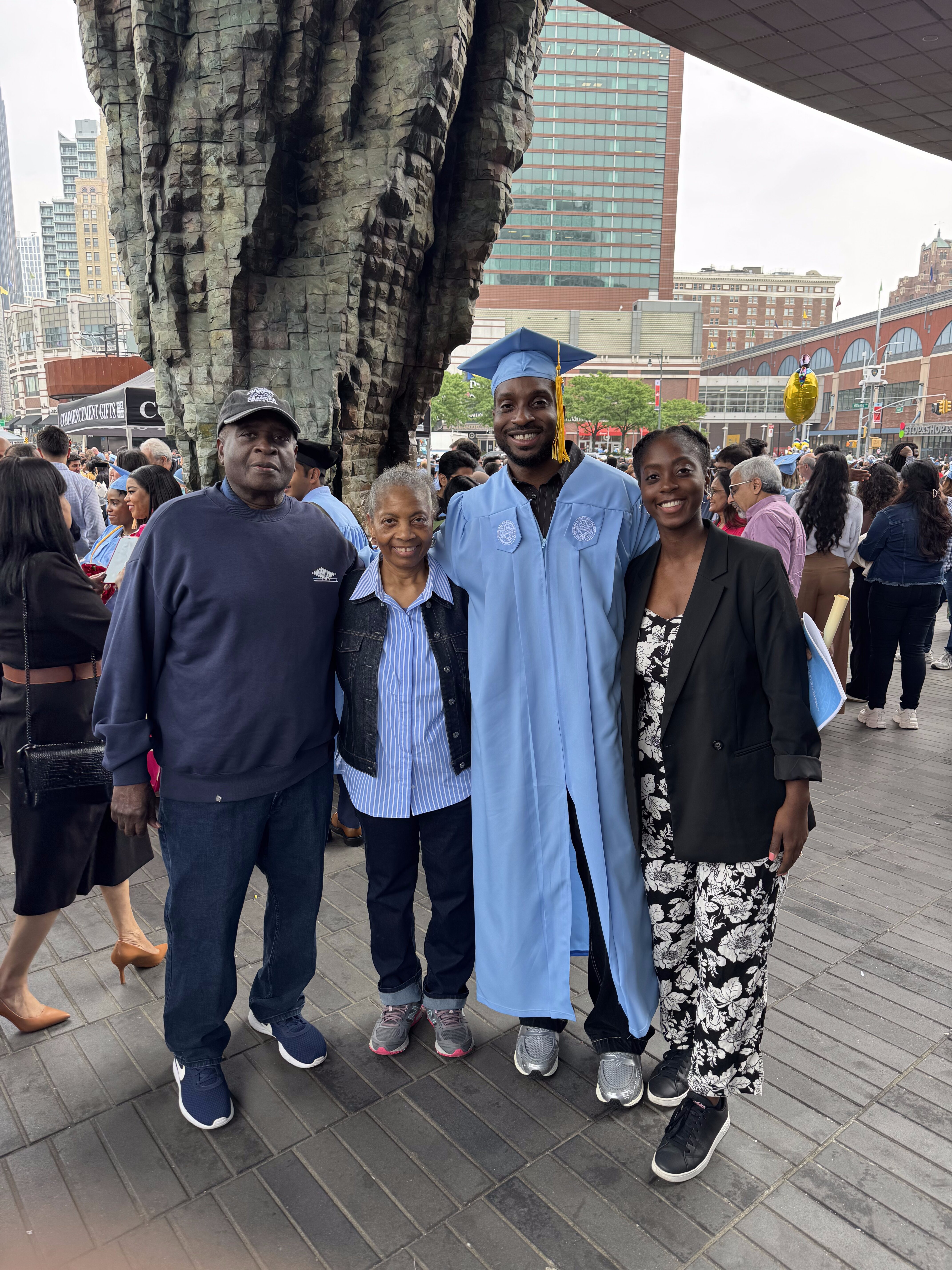James Severe alongside his parents and sister celebrating his graduation from the Roc Nation School of Music, Sports, & Entertainment at Long Island University.