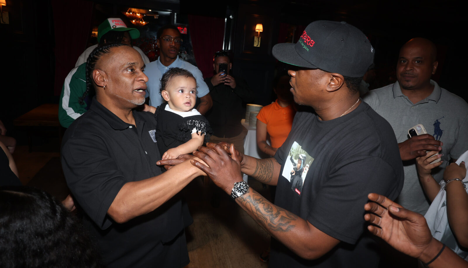 REFORM's New York State Organizer Anthony Rivera and his daughter Baylin meet rapper Jadakiss