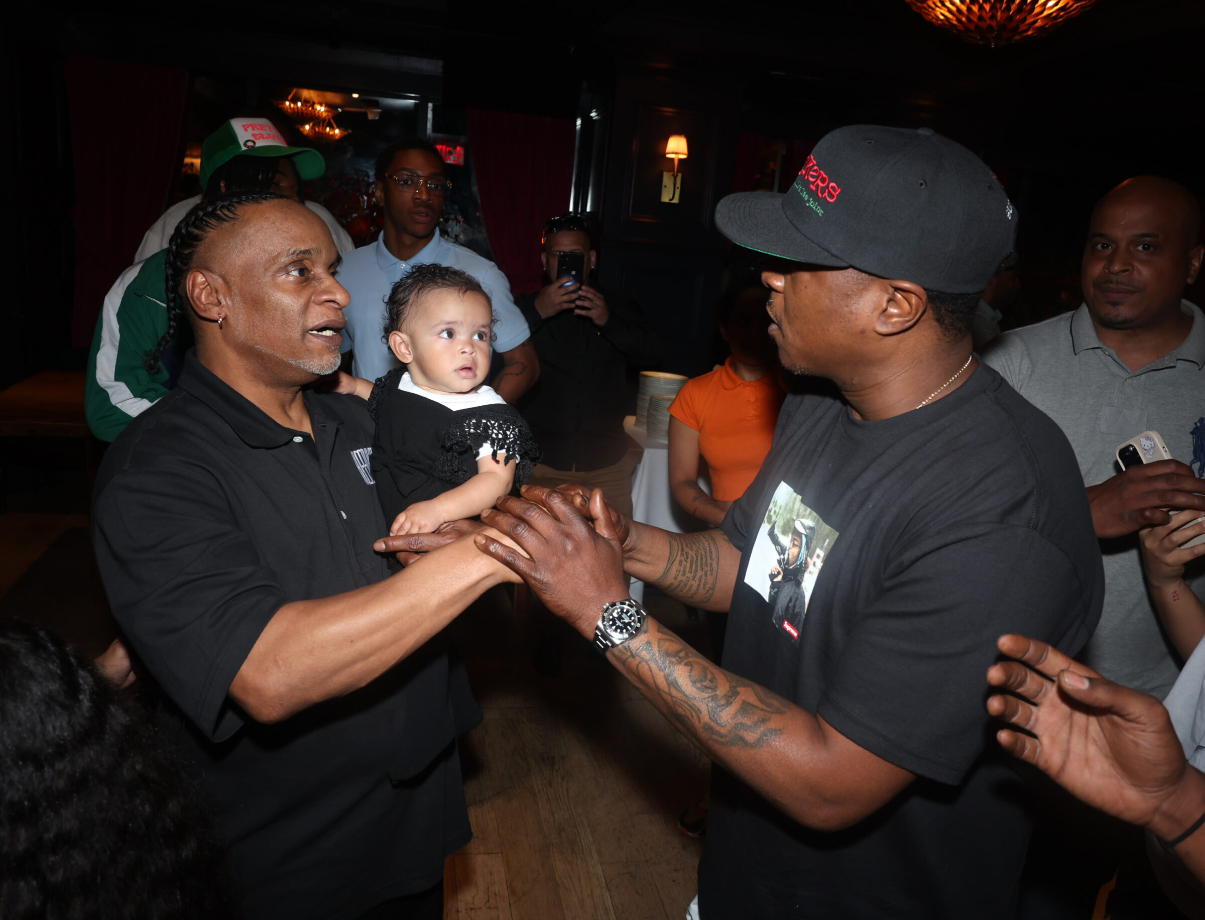 REFORM's New York State Organizer Anthony Rivera and his daughter Baylin meet rapper Jadakiss