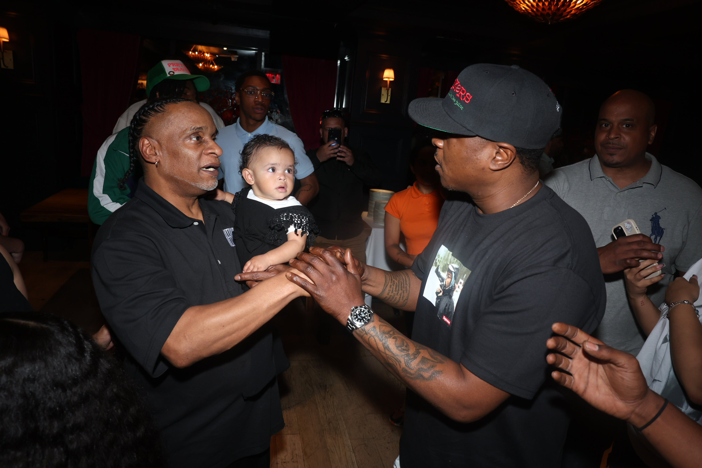 REFORM's New York State Organizer Anthony Rivera and his daughter Baylin meet rapper Jadakiss